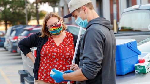 Faculty and student testing a sample